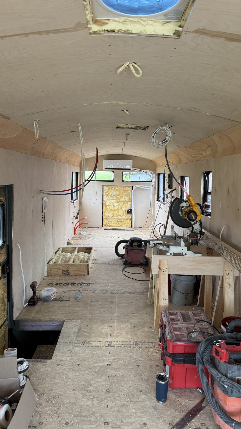 Queen bed with mini-split and RV windows