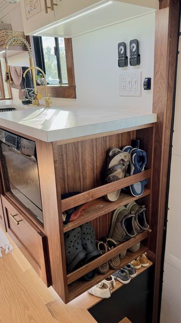 Walnut shoe rack at the entry