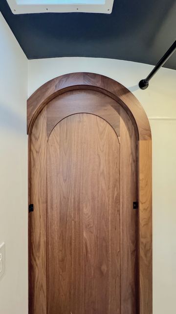 The arched walnut door