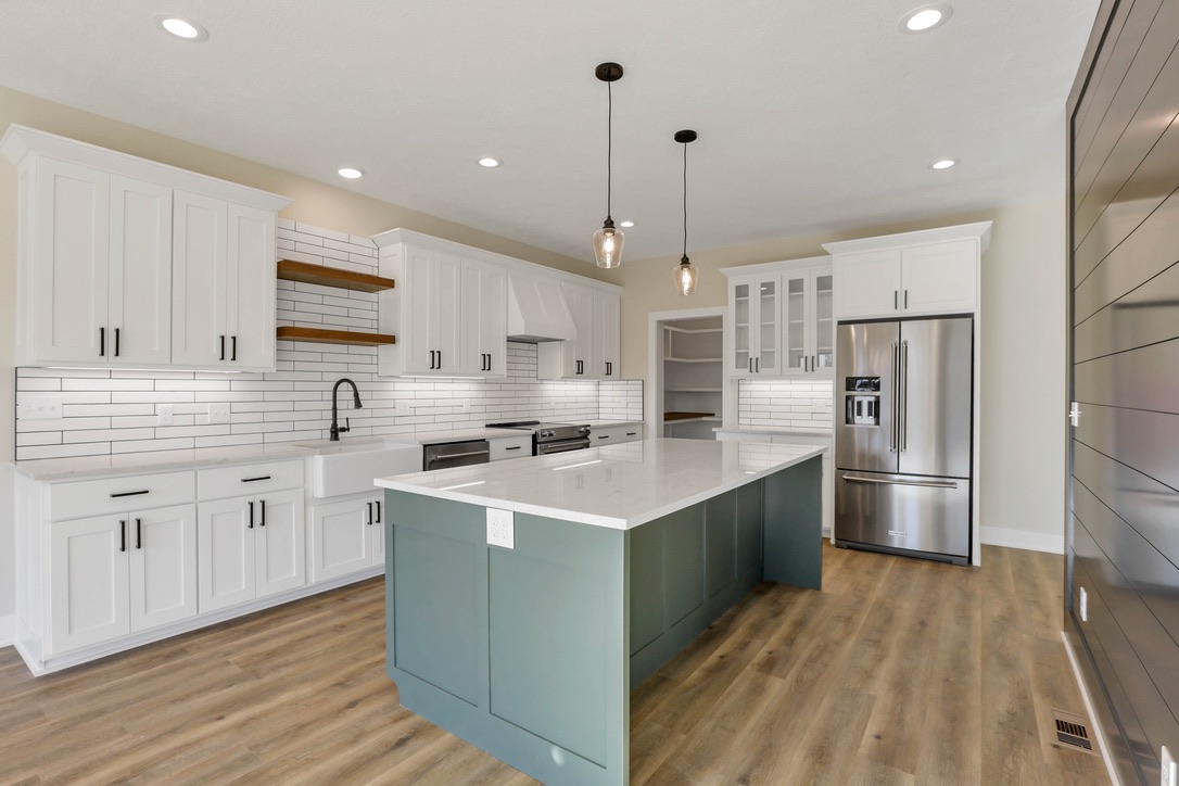 Custom kitchen with teal island